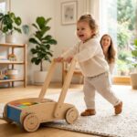 happy toddler pushing a wooden push car for toddlers